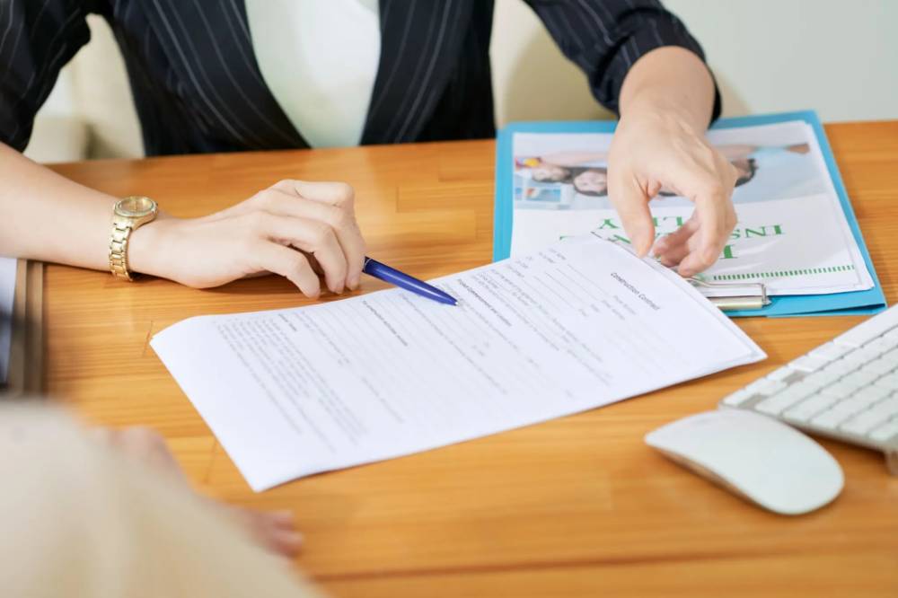 HR professional reviewing payroll documents and employee records for payroll processing, tax compliance, and salary management in India.